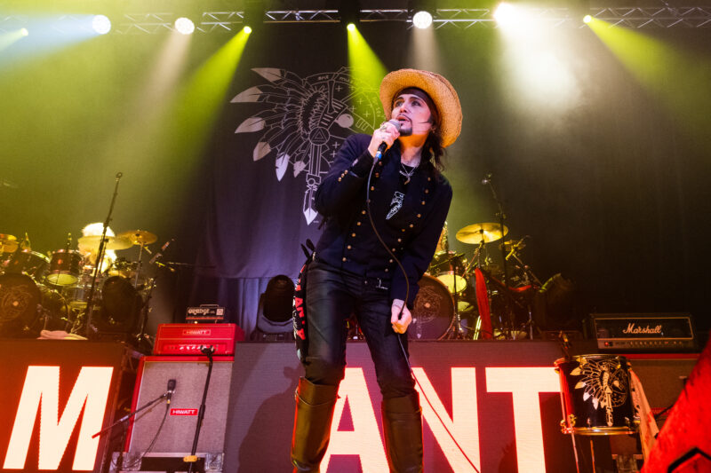 Adam Ant singing on stage
