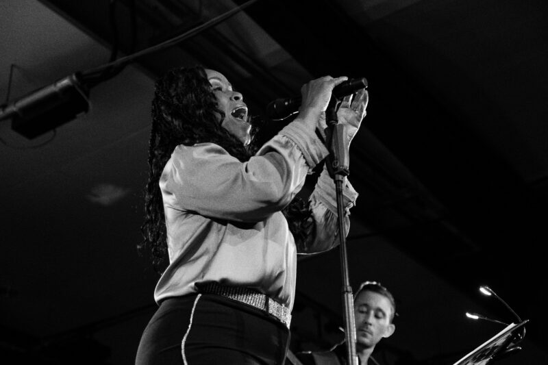 black and white image of performer on stage