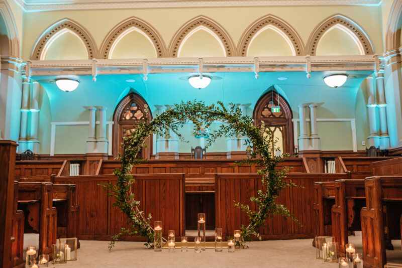 floral arrangement at the front of the courtroom